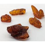 A collection of 5 19th century Chinese carved amber animals