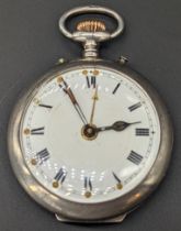 A silver open face alarm pocket watch, white enamel dial, Roman index, outer minute track and gilt