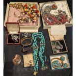 A collection of costume jewellery to include turquoise, brooches, necklaces, earrings