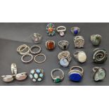 A collection of silver rings, mounted with Lapis Lazuli and other stones