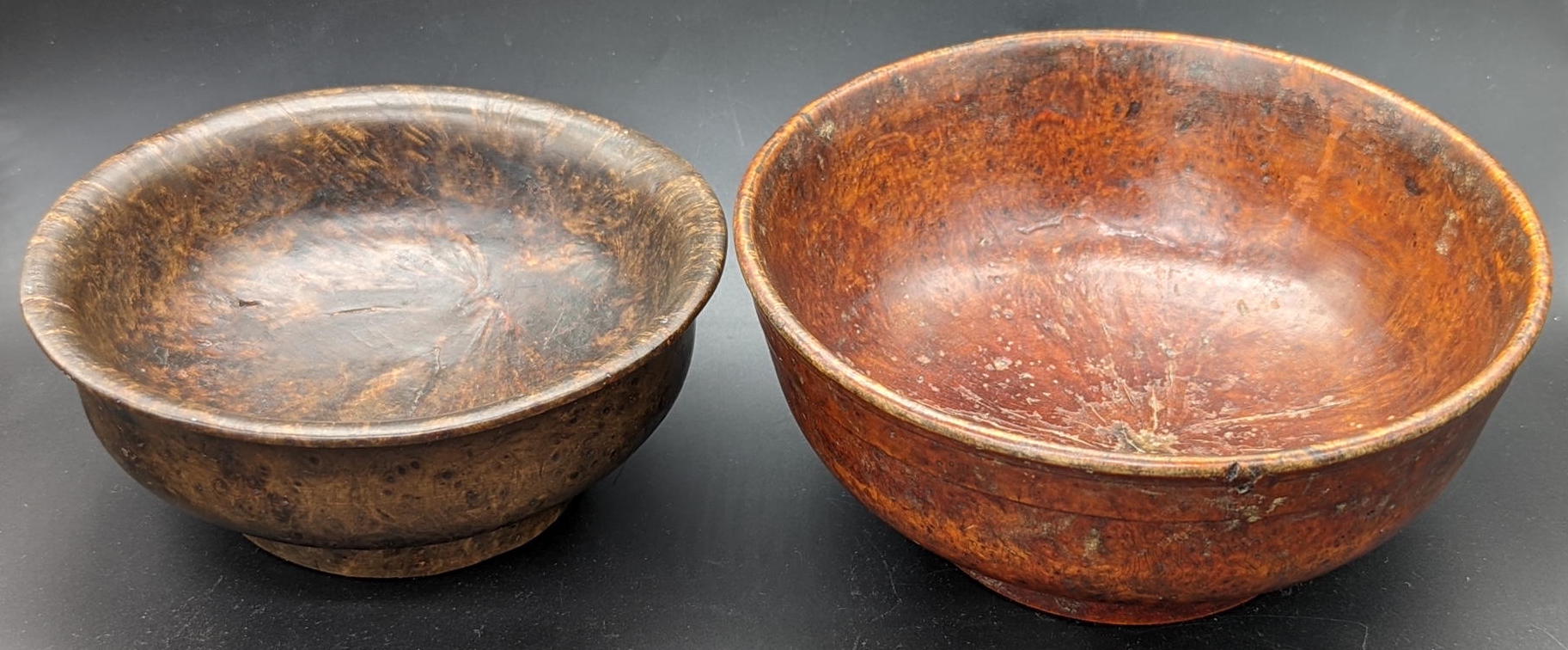 A pair of 18th or 19th century Chinese lacquered wooden bowls, one with character mark to base, D.