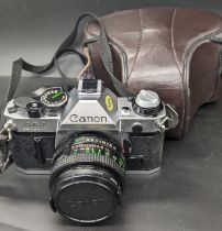 A Canon AE-1 camera, 50mm lens