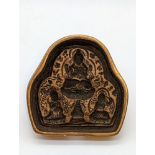 An early 20th century Buddhist brass votive plaque (Tsha Tsha), Tibet, W.8cm