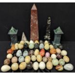 A collection of marble eggs and obelisks