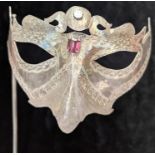 An Italian silver Venetian mask, mounted with 2 stones,