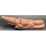 An unusual 19th century Ottoman Egyptian tophane clay crocodile foot scrubber, L.22.5cm