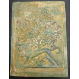 A rare 17th century Persian Safavid green glazed tile depicting a lion under a tree and calligraphy,