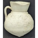 A fine 12-13th century unglazed pottery jug, inscribed central banding, Syria or Anatolia , H.15cm