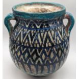 A rare early 17th century Ottoman Syrian Damascus glazed pottery twin handled vase/ jar, H.21.5cm