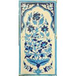 A 19th century Multan tile, blue and white with floral motifs, mounted with wooden frame, H.45cm W.