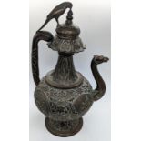 A fine 19th century Indian brass zoomorphic Ewer with camel shape spout, parrot finial and naga