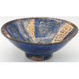 A rare 13th century Persian Seljuk copper luster and cobalt blue glazed pottery bowl, H.6.5cm W.16.