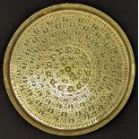 A fine 18th century Mughal Indian engraved brass tray, D.34cm