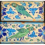 Two early/mid 19th century Mughal multan tiles depicting green parrots, each 15.5cm x 30cm