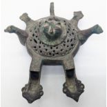 A fine 12-13th century Persian Seljuk bronze double spouted oil lamp with 2 bird heads finials,