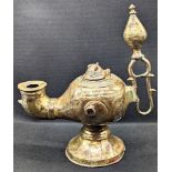 A large 12-13th century Persian Seljuk copper inlaid bronze oil lamp, H.23cm L.21cm