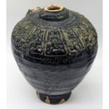 A 8-9th century Umayyad glazed pottery jar, H.16cm