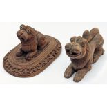 Two 19th century Indian Mysore carved sandalwood Lions, L.11cm (largest)