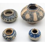 A rare 14th century Persian Sultanabad glazed pottery inkwell together with three 17th century