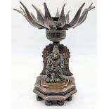 A 19th century Indian bronze lotus oil lamp, turning mechanism to open and close, octagonal base