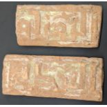 Two 10th century Ghaznavid border tiles depicting Kufic calligraphy, L.12cm and 10.5cm