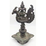 A rare 17-18th century south Indian bronze oil lamp with a Lakshmi riding a hamsa bird finial, H.