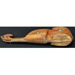 An early 20th century Afghan Rubab musical instrument, short necked lute made of wood with goatskin,