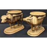 A very fine pair of 19th century Anglo-Indian carved wooden buffalo shaped bowls or bottle coasters