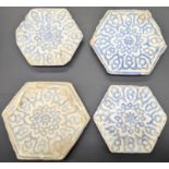 A set of four 14-15th century Persian or Central Asian timurid hexagonal tiles,
