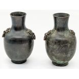 A pair of Chinese or Japanese bronze vases, indistinct mark to base, H.10cm