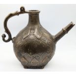 An early 18th century Mughal engraved brass Ewer, North India, H.23cm