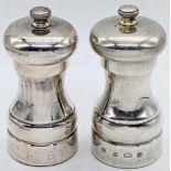 A pair of modern silver pepper grinders, hallmarked Birmingham, maker PHV & Co., 285g, H.12cm