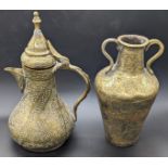 A pair of 19th century Islamic brass jars with etched calligraphy, H.20cm (largest)