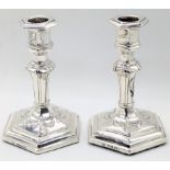 A pair of Victorian silver fluted candlesticks, turned stems with hexagonal insert tops with matchi
