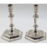 A pair of Queen Anne style silver tapered candlesticks by Garrard & Co. Ltd, hallmarked London,