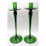 A pair of Art Nouveau green glass candlesticks, H.32cm