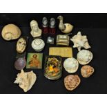 A collection of shells, bone boxes and other desk top interior items