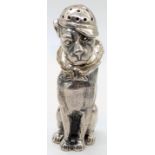 A silver pepper in the form of a seated dog wearing a cap, twist opening, hallmarked London, 2006,