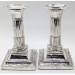 A pair of Victorian silver column candlesticks, hallmarked London, 1897, maker William Hutton & Son