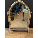 An arch shaped dressing table mirror, H.77cm