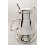 A large fine Gerald Benney jug on circular stand, hinged lid, hallmarked London, 1965, marked to the