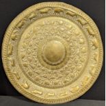 A large Sri Lankan brass tray, embossed with animals, D.60cm