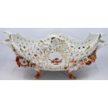 A large 19th Century Meissen Red Dragon pattern twin handled floral basket raised upon four