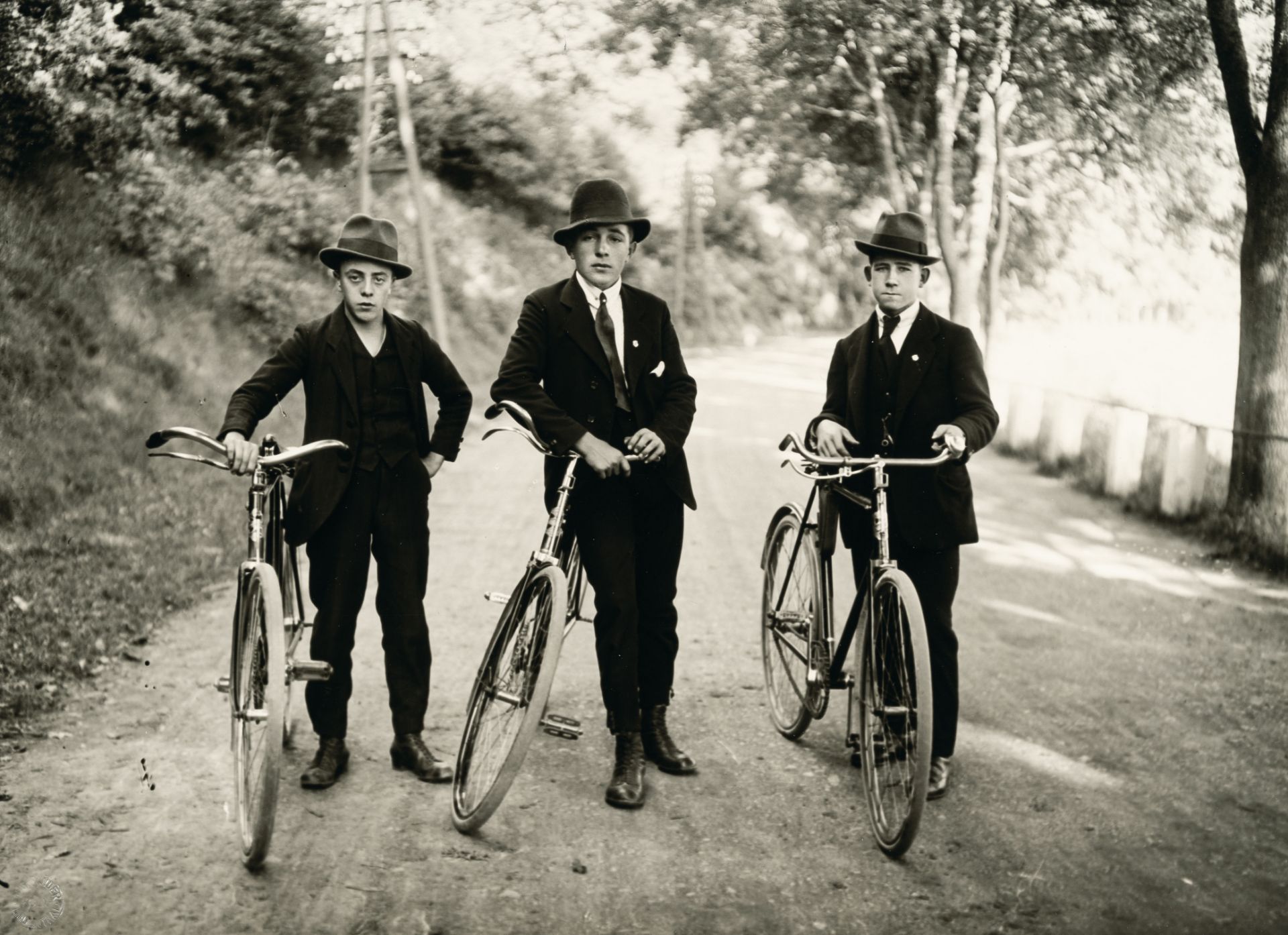 August Sander, Three young farmers with bicycles.Vintage gelatin silver print on photo paper. (