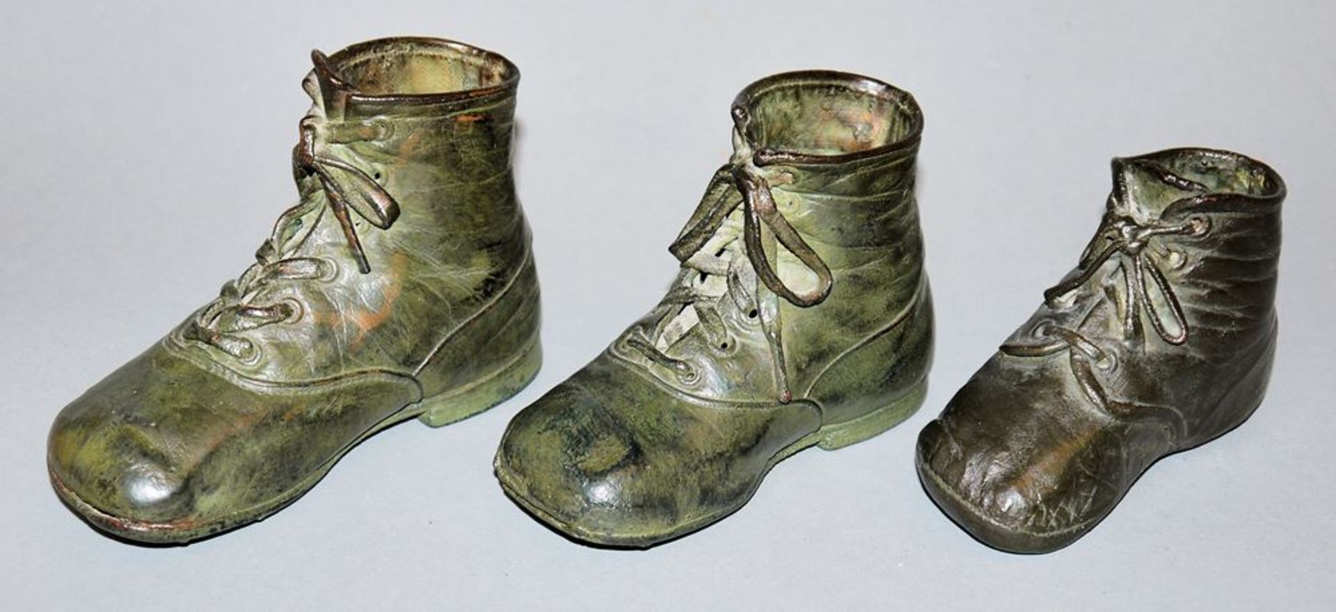 Three "first shoes", galvanically copper-plated, early 20th century