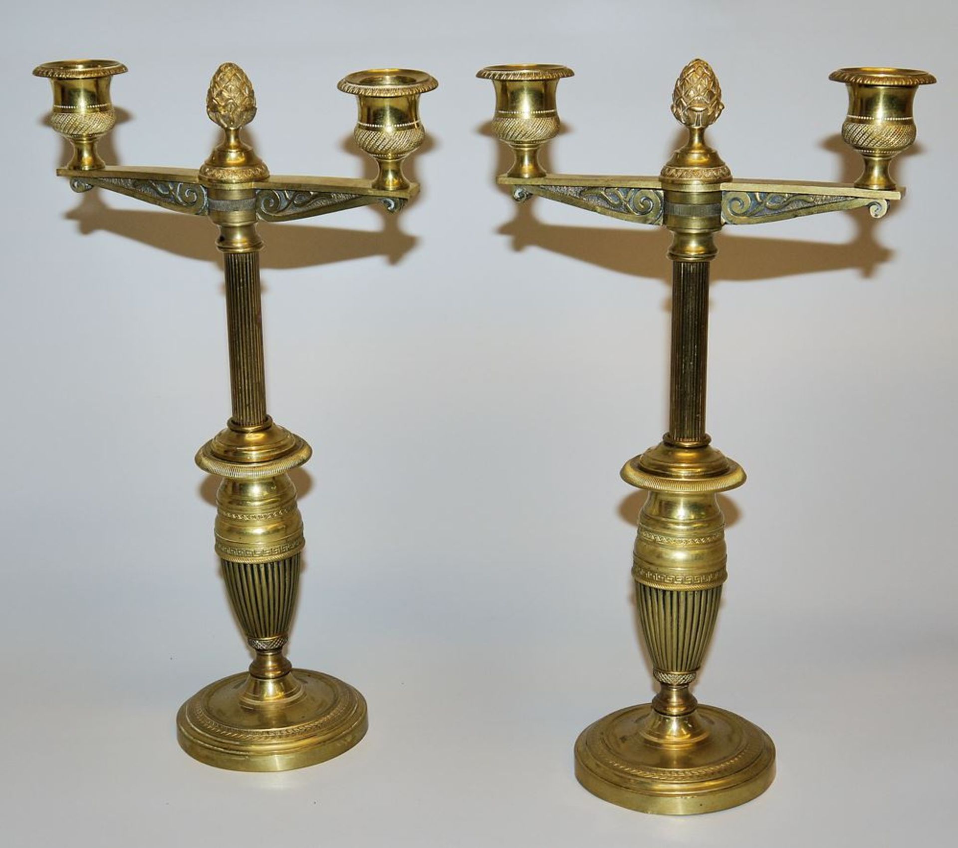 Pair of double Empire candlesticks, brass, fire-gilt, France, c. 1810