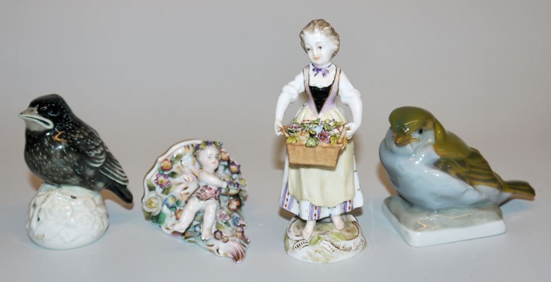 Four porcelain sculptures Gärtnerin, small console with putto, young starling and sparrow, C. Thiem