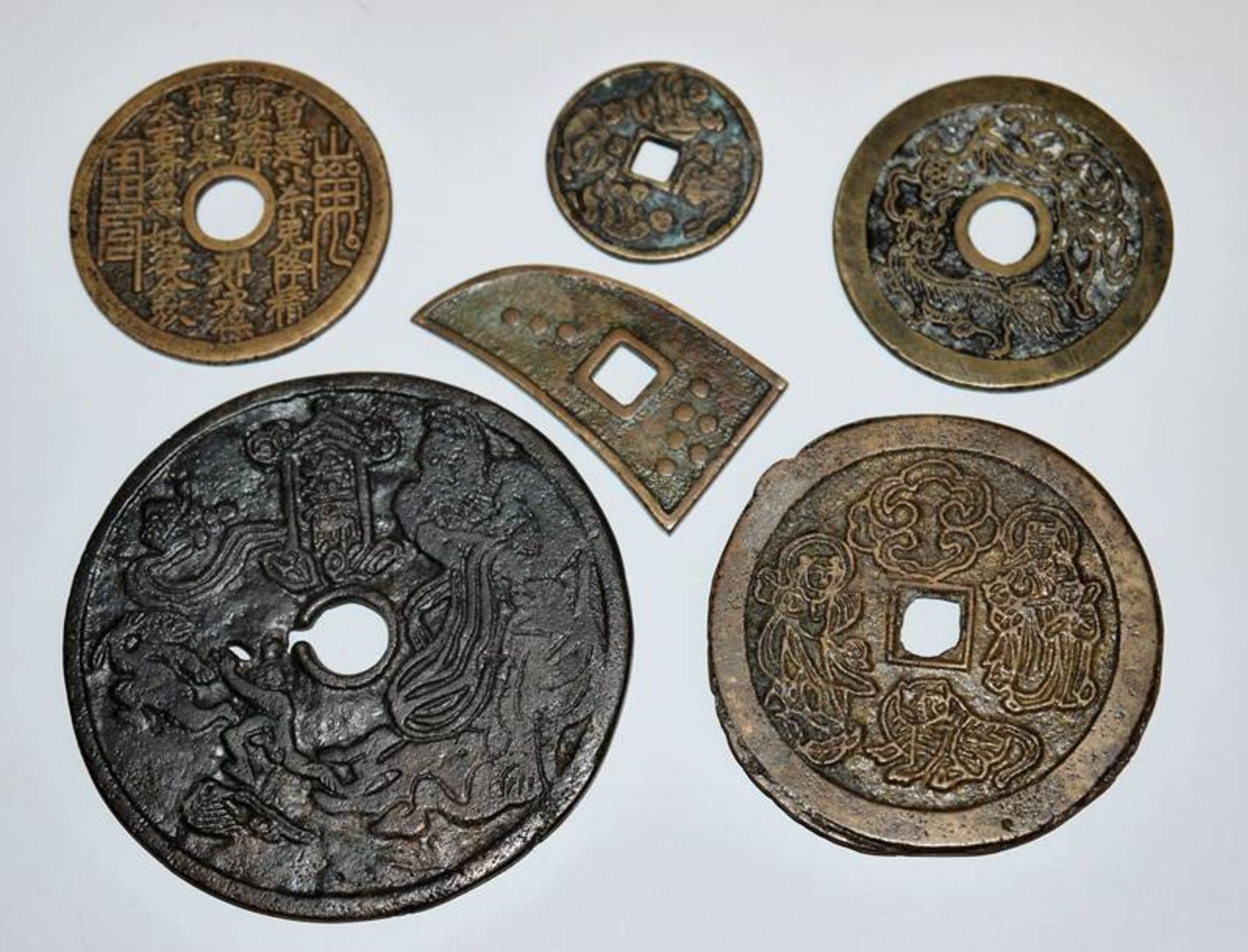 Six numismatic bronze charms from the Chinese Ming/Qing period