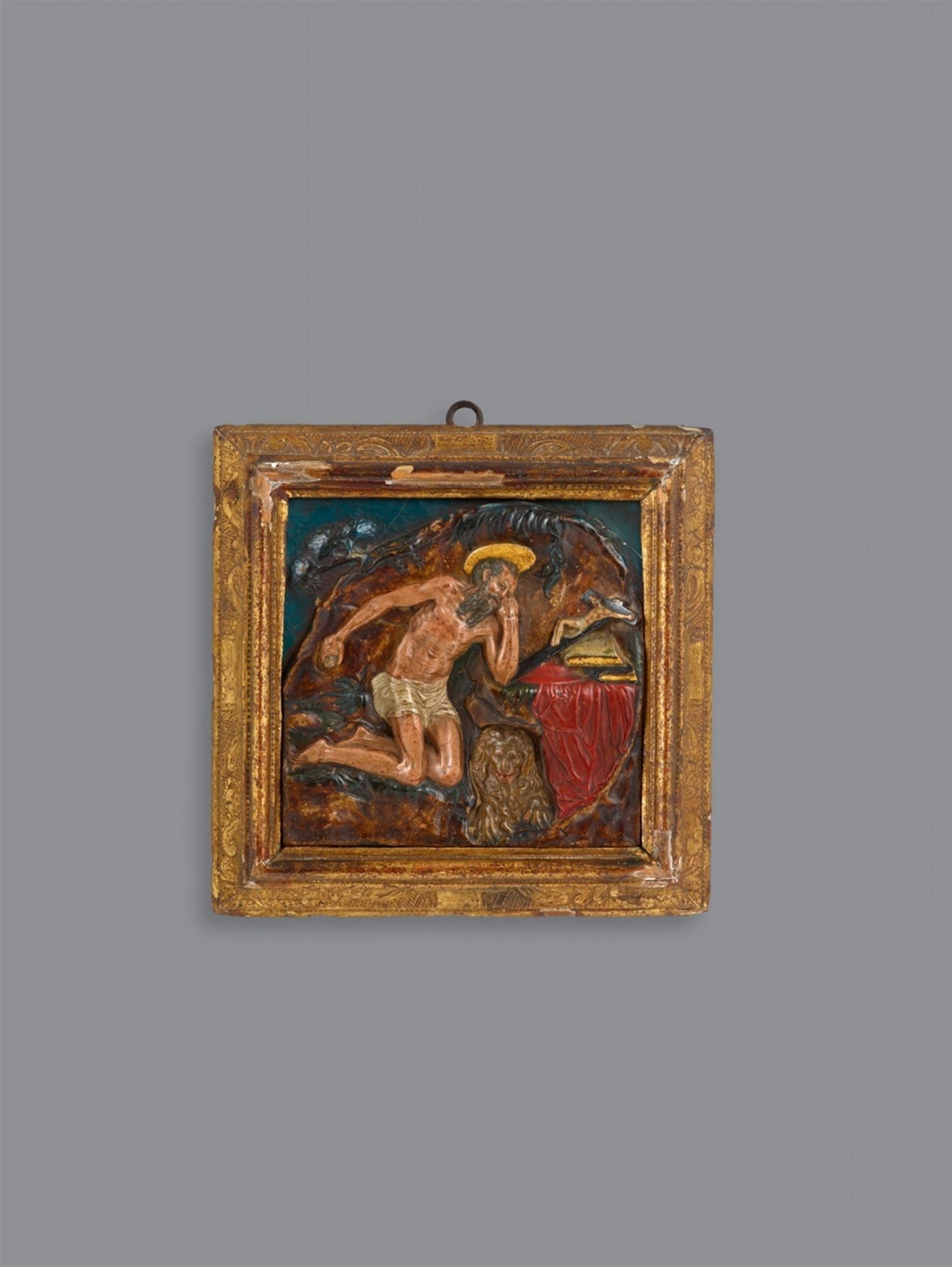 A late 17th century polychrome terracotta relief of the penitent Saint Jerome