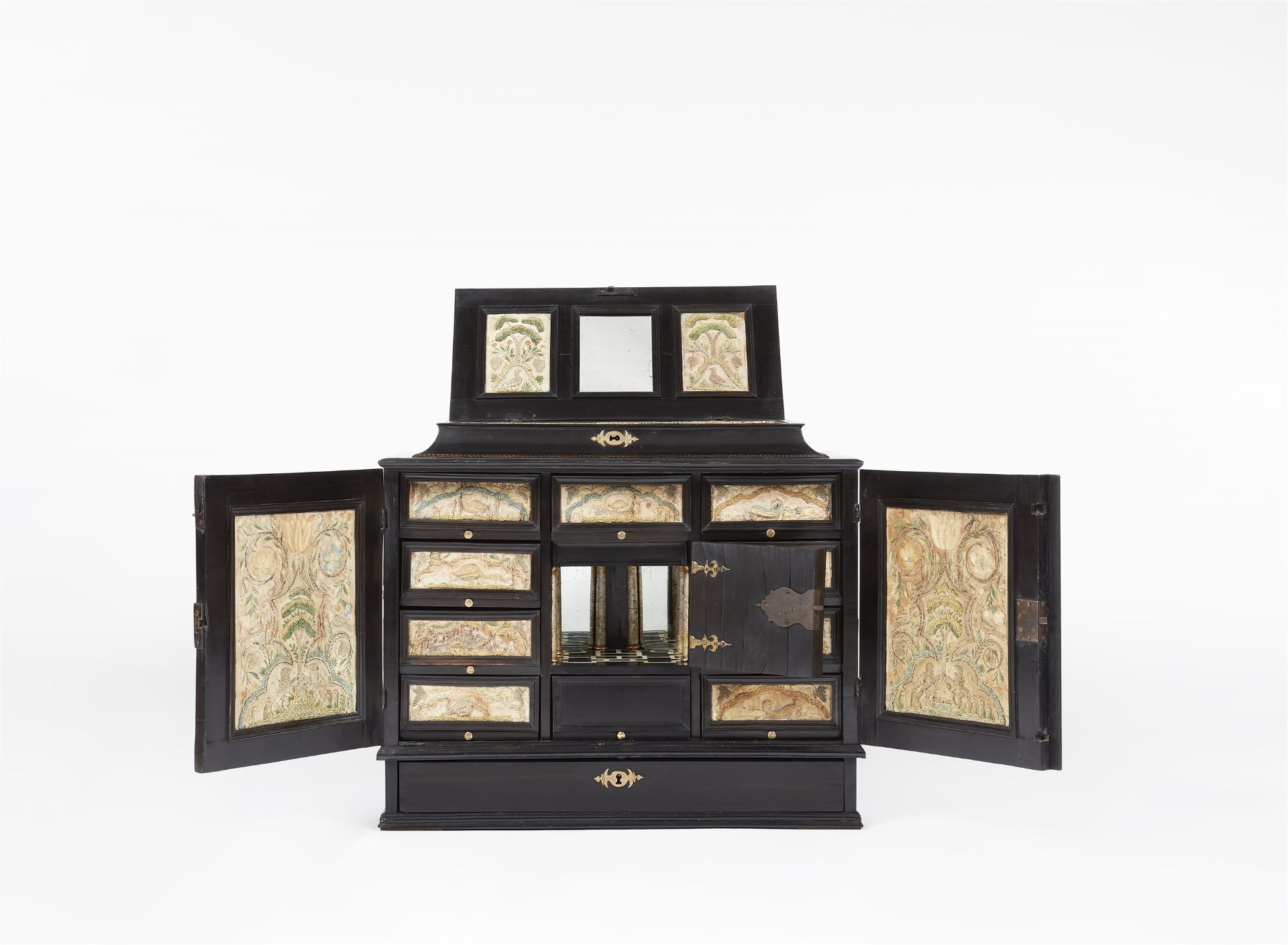 A Flemish table cabinet with raised embroidery